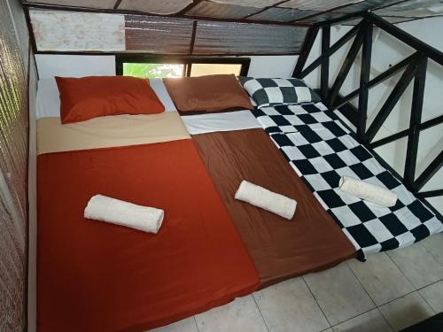 Postel nebo postele na pokoji v ubytování Mannah Garden Staycation House - Panglao, Bohol