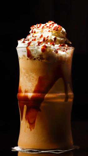 a dessert in a cup with whipped cream and sprinkles at فندق فيو الشاطي - Beach View Hotel in Dammam
