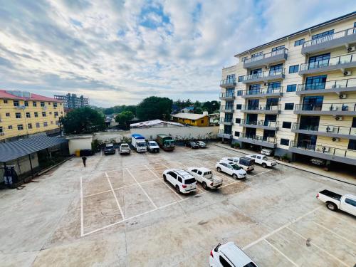 an aerial view of a parking lot in front of a building at Times Mansion Hotel King Twin bed in Freetown