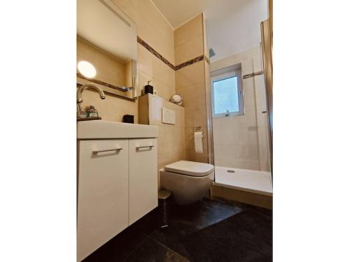 a bathroom with a toilet and a sink and a shower at Nele Daniel family in Waldeck