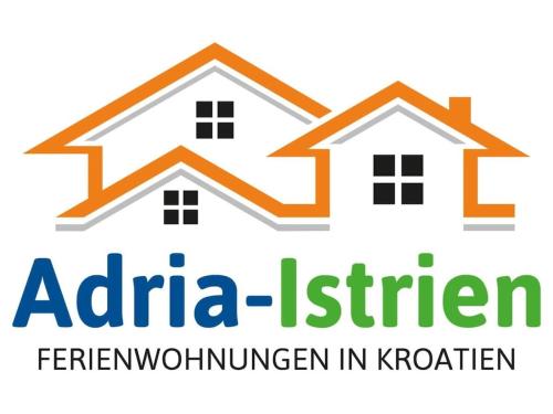 an image of two houses with the akita kitchen logo at in the swimming pool Villa Brioni 2 in Peroj