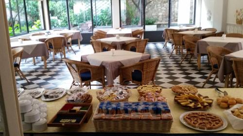a table with food on it in a restaurant at Albergo Lungomare in Bonassola