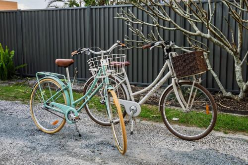two bikes are parked next to each other at Bilinga Breeze - Walk to North Kirra Beach and Airport in Gold Coast