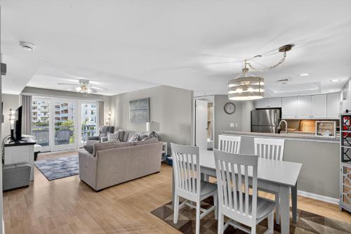 a kitchen and living room with a table and chairs at Wildwood Crest SeaPointe Village Condo condo in Diamond Beach