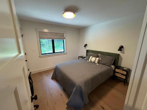 Ένα ή περισσότερα κρεβάτια σε δωμάτιο στο Spacious 5 bedroom Mountain Chalet with Sauna