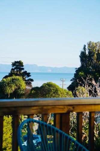 a view of the ocean from a balcony at Seaview Sanctuary - stunning sea and bush location in Pohara