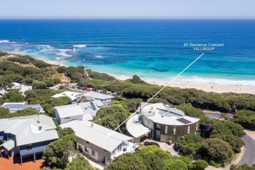 an aerial view of a house and the beach at Idlehour - Charming Retreat by Yallingup Beach in Yallingup