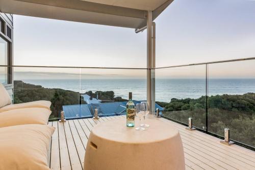 a living room with a view of the ocean at Idlehour - Charming Retreat by Yallingup Beach in Yallingup
