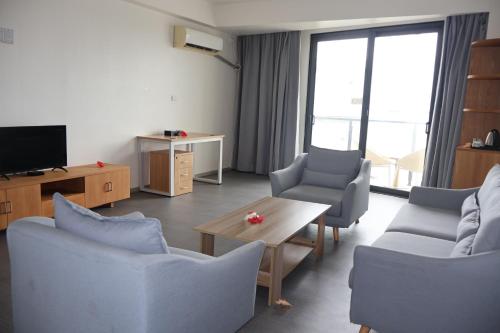 TV a/nebo společenská místnost v ubytování Nalagi Hotel