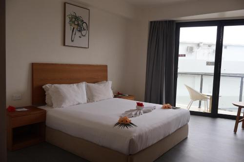 Postel nebo postele na pokoji v ubytování Nalagi Hotel