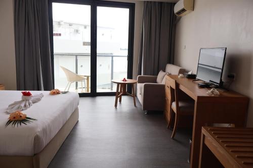 Postel nebo postele na pokoji v ubytování Nalagi Hotel