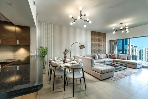a living room with a couch and a table at Desert Key - Platinum Apartments in Gate Tower, Al Reem Island in Abu Dhabi