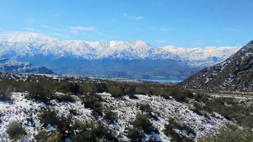 a view of a mountain range with snow covered mountains at Terrana Ecolodge Mountain Domes in Ciudad Lujan de Cuyo