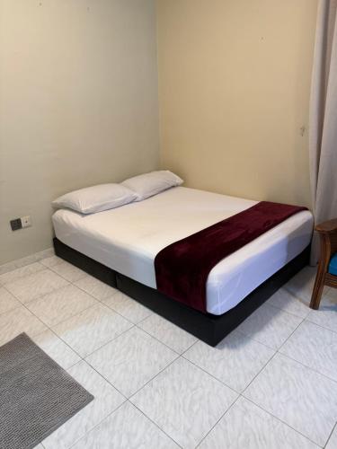 a bedroom with a bed in a room at Green Cove Villa A Famosa Karaoke Netflix Private pool in Simpang Empat