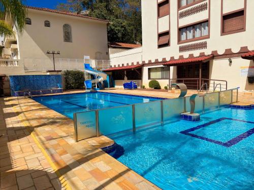 La alberca dentro o cerca de Ap Praça Central - Wi-fi, Piscina, Garagem