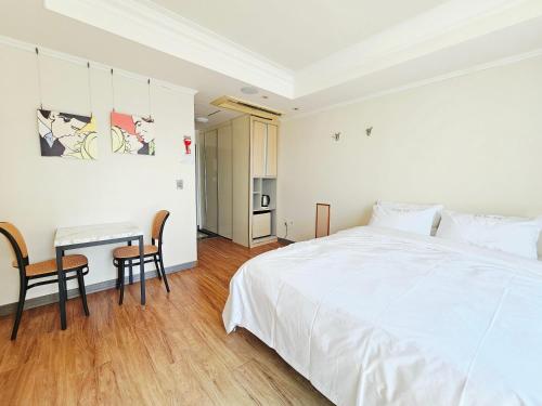 Ένα ή περισσότερα κρεβάτια σε δωμάτιο στο Tongyeong Bay Condo Hotel