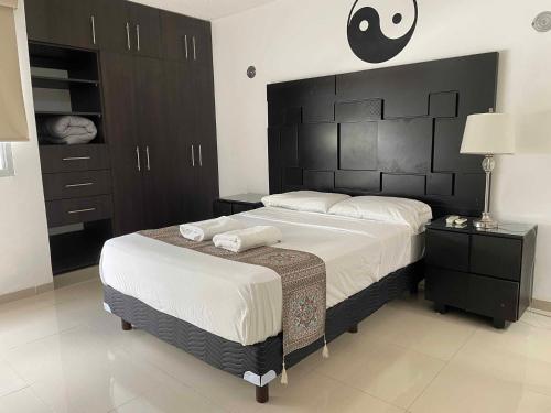 Ένα ή περισσότερα κρεβάτια σε δωμάτιο στο Tu lugar en Merida