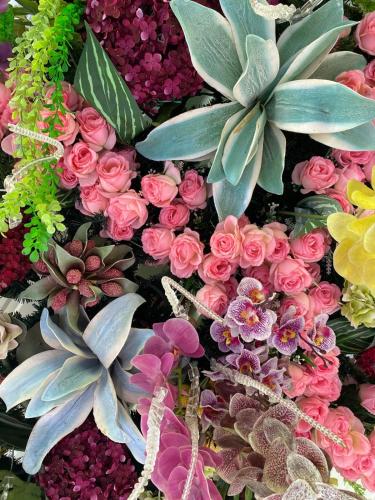 a pile of different colored flowers and plants at Hotel Campestre Las Margaritas Rivera in Rivera
