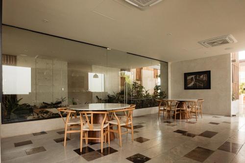 Μια τηλεόραση ή/και κέντρο ψυχαγωγίας στο Loft, con alberca, gym y coworking en Temozon Norte