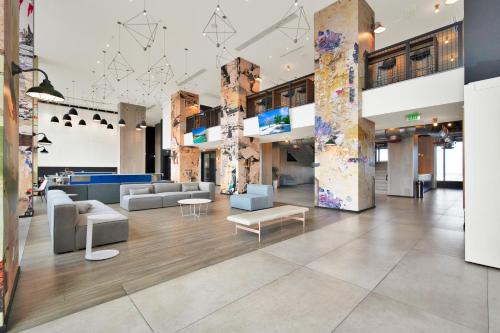 a lobby of a building with couches and tables at Luxury studio Miami in Miami