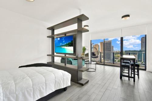 a bedroom with a bed and a flat screen tv at Luxury studio Miami in Miami