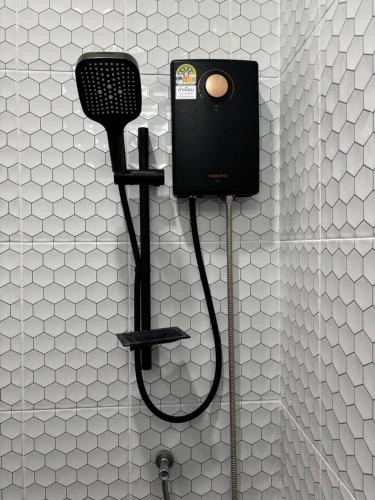 a bathroom with a blow dryer and a microphone at Kalamung Resort and Pool villas in Ao Nang Beach