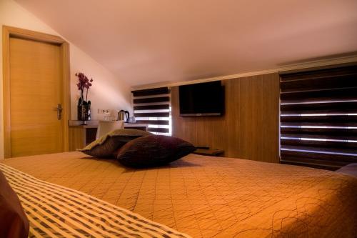 Postel nebo postele na pokoji v ubytování Villa Martini - apartments & rooms