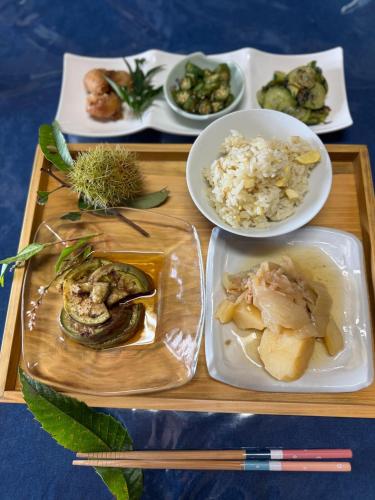 a tray with plates of food on a table at Kekanosato Kojyo - Vacation STAY 33013v in Sadamitsu