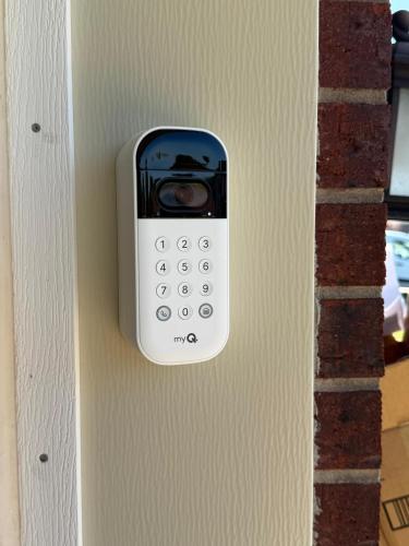 a cell phone is attached to a wall at Fun & Comfort for 8 in Roger! King & Arcade Games in Rogers