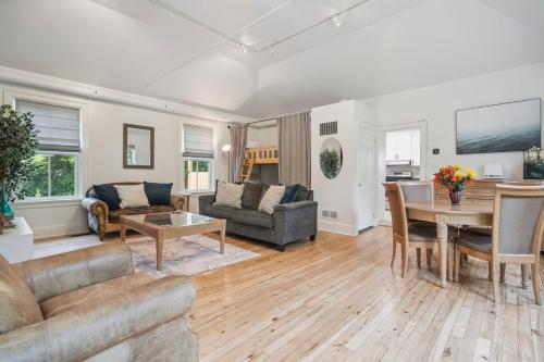 a living room with a couch and a table at Niagara on the Lake Walkable Old Town Retreat in Niagara on the Lake