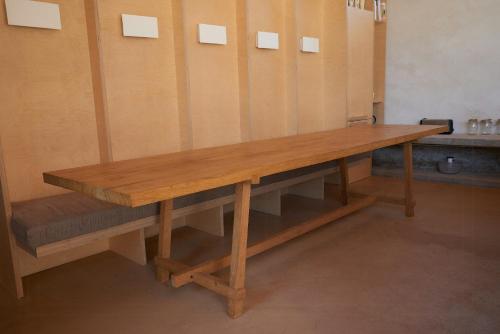 a long wooden bench in a locker room at Restored Farm Estate Near Atlantic Coast France in La-Gripperie-Saint-Symphorien