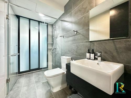 a bathroom with a white sink and a toilet at Almas Suites by RR JBcity in Nusajaya