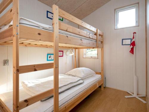 a bedroom with two bunk beds in a room at 6 person holiday home in Frørup in Frørup