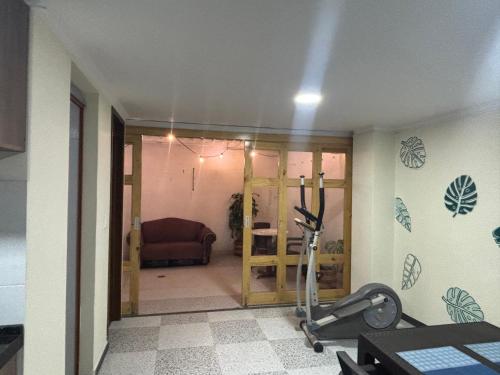 a room with a gym with a treadmill in it at Apartamento Jaime Rook in Paipa