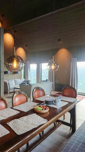 a dining room with a table and chairs at Mountain Cabin With Panoramic Views In Oppdal in Gorset