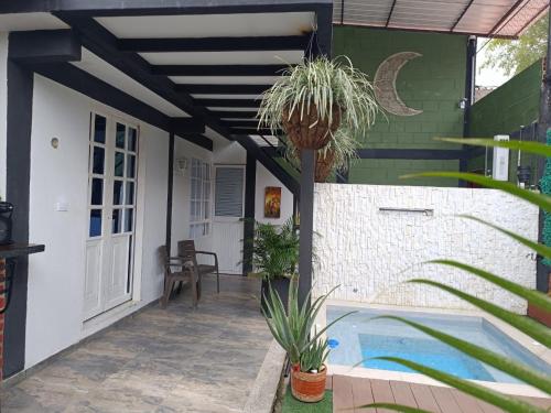 a patio with a swimming pool and a house at Casa Luna Lago Calima in Calima