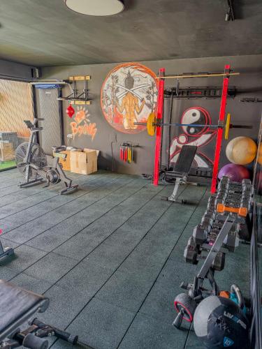a room with a gym with equipment in it at Galilee Hills - Resort & Suites in Maghār