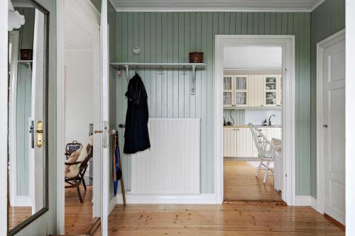 a hallway with a door leading to a kitchen at Villa Berget in Fröseke