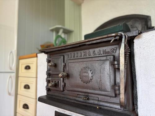 an old stove sitting on top of a wall at Villa Berget in Fröseke