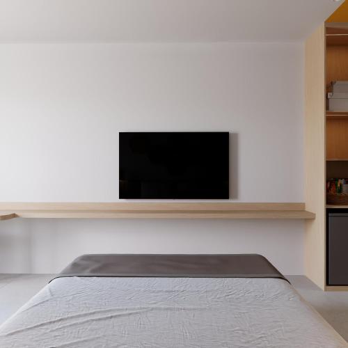 TV a/nebo společenská místnost v ubytování Bcons City Hotel