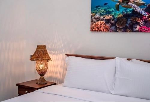 Postel nebo postele na pokoji v ubytování Turtle Bay Cottage