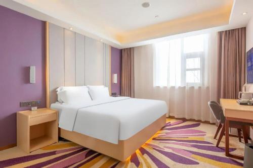 Letto o letti in una camera di Lavande Hotels Jinzhong Youjian Pingyao