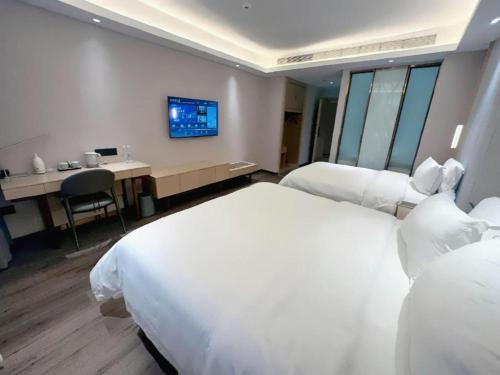 Letto o letti in una camera di Lavande Hotels Jinzhong Youjian Pingyao