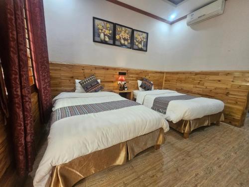 Ένα ή περισσότερα κρεβάτια σε δωμάτιο στο Dang Khoa Garden Inn