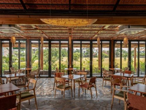 Restaurace v ubytování Anmira Resort & Spa Hoi An by The Unlimited Collection, Managed by the Ascott
