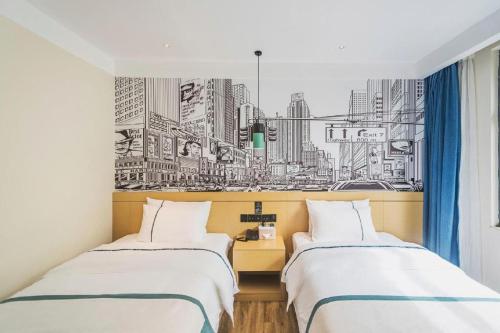 two beds in a room with a drawing of a city at City Comfort Inn Lhasa Potala Palace Scenic View in Lhasa