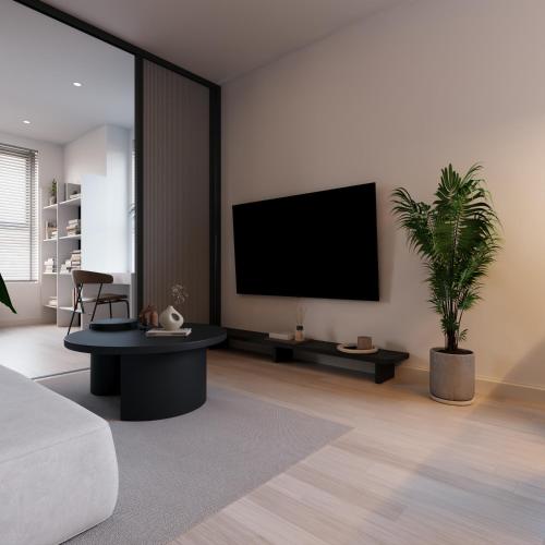TV a/nebo společenská místnost v ubytování Bcons City Hotel