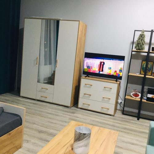 TV i/ili multimedijalni sistem u objektu Dream Studio