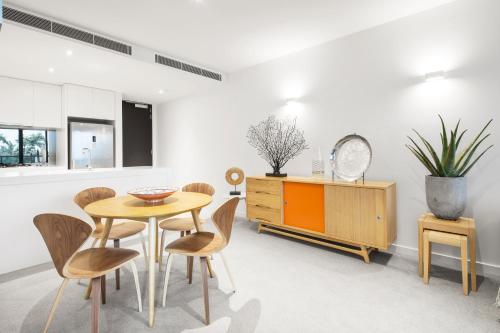 a living room filled with furniture and a table at Boutique Abode 316 in Melbourne