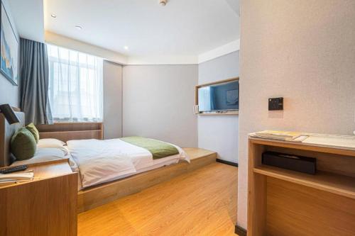 Ένα ή περισσότερα κρεβάτια σε δωμάτιο στο Green Tree Inn Anhui Tianchang Economic Development Zone